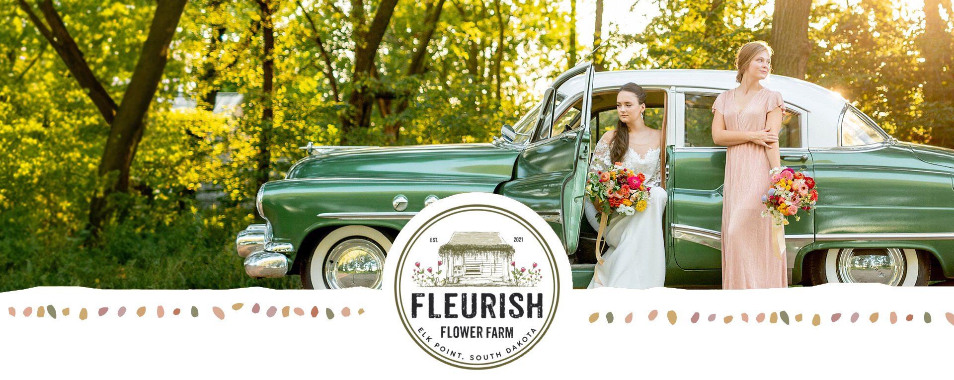 Vintage green sedan with a bride sitting in the drivers seat. Her bridesmaid is standing next to her both are holding Fleurish Flower Farm bouquets.